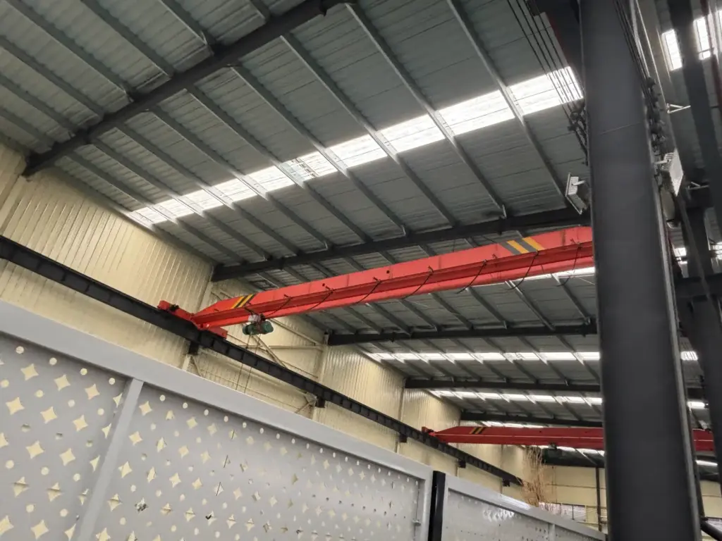 Single girder overhead crane in factory workshop